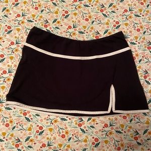 Black and pink mini tennis skirt